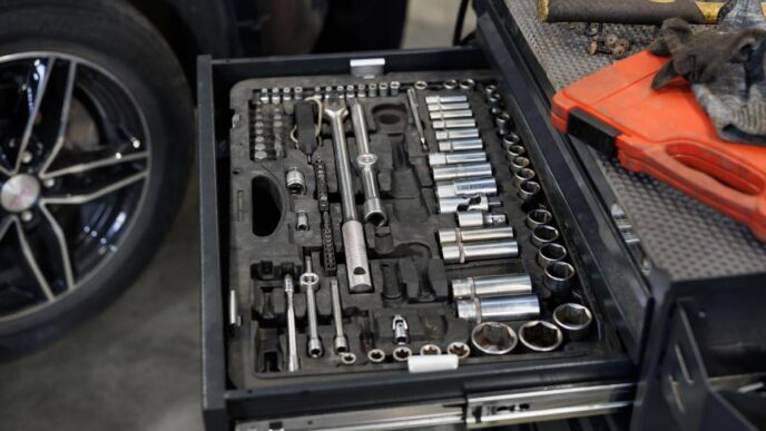 A well-organized Husky tool box set in a sunlit garage, showcasing essential tools.