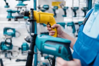 A hyperrealistic photo of top 2024 power tools on a polished workshop workbench.