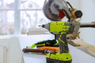 A well-organized home workshop featuring advanced cordless power tools on a polished workbench.